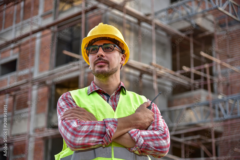 Construction supervisor inspecting building site Construction supervisor inspecting building site