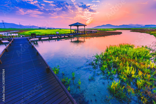 Walkway and sunrise at salt farm Jeungdo island,South Korea.