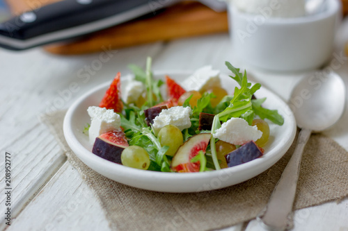 Vegetarian salad with figs and goar cheese.