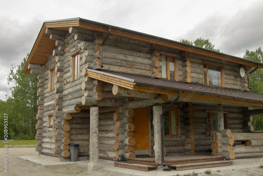 The house for rest from natural wood, dry logs.