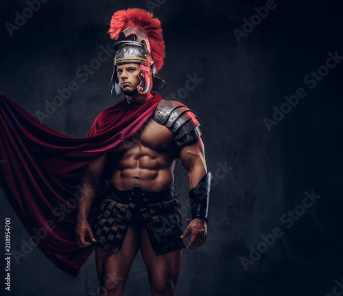 Portrait of a brutal Roman legionary in battle uniforms photo