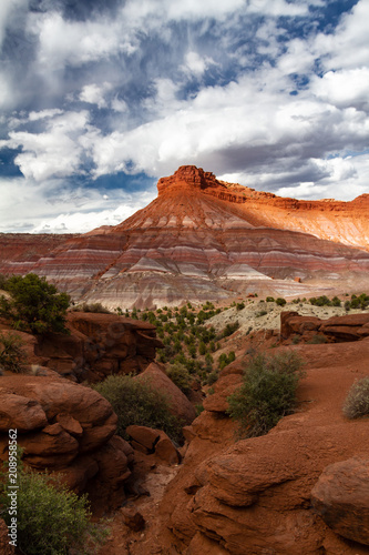 Spectacular vertical shot of the amazing different colored mountain formations of Grand Staircase-Escalante National Monument in Paria, Utah USA. photo