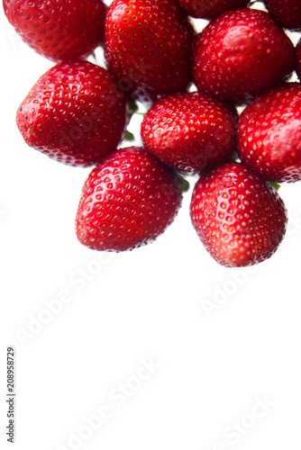 Several healthy red strawberries on an isolated background