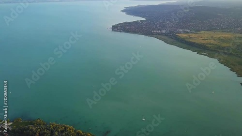 Balatonfuzfo, Hungary - 4K aerial skyline view of Lake Balaton with Fuzfoi-obol, Balatonalmadi and sailboats photo