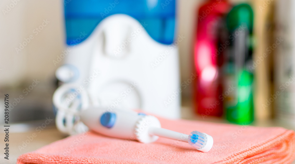 Oral hygiene. Irrigator for cleaning teeth.