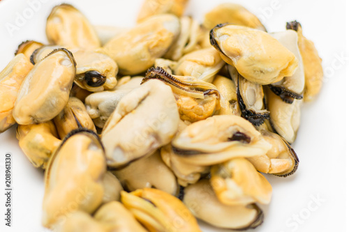 Peeled mussels on a white background.