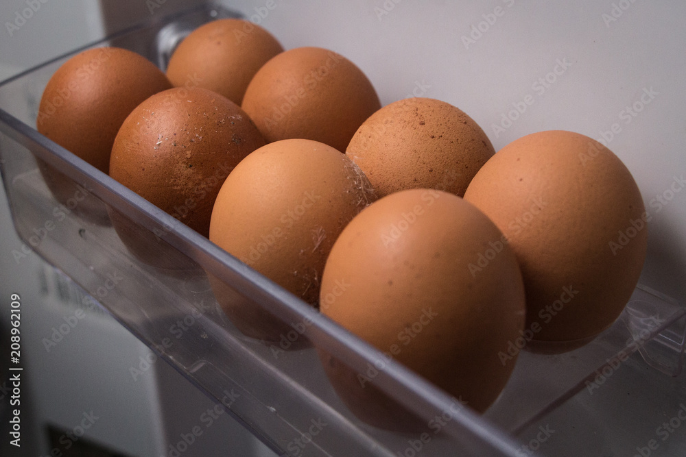Chicken eggs on a shelf in the fridge. Chicken eggs on a shelf in the fridge.