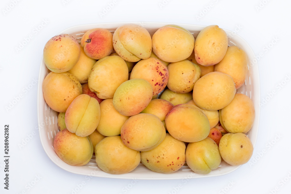 fresh apricots for background close-up (isolated on white background)