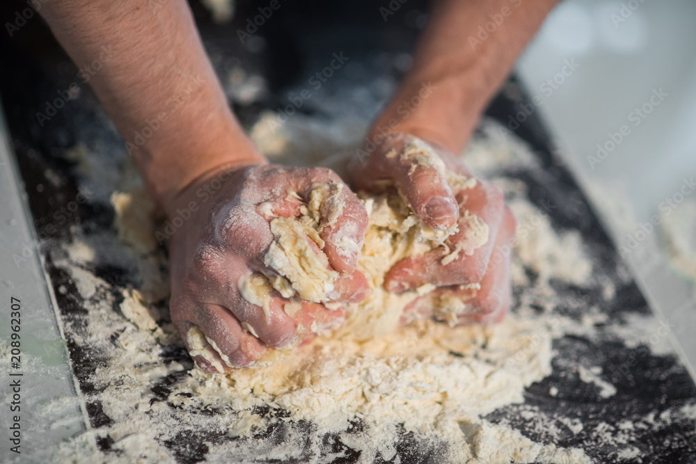 a man prepares the dough a man prepares the dough