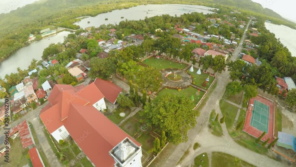 Aerial view Poblacion city with catholic church in the Philippines. Anda.