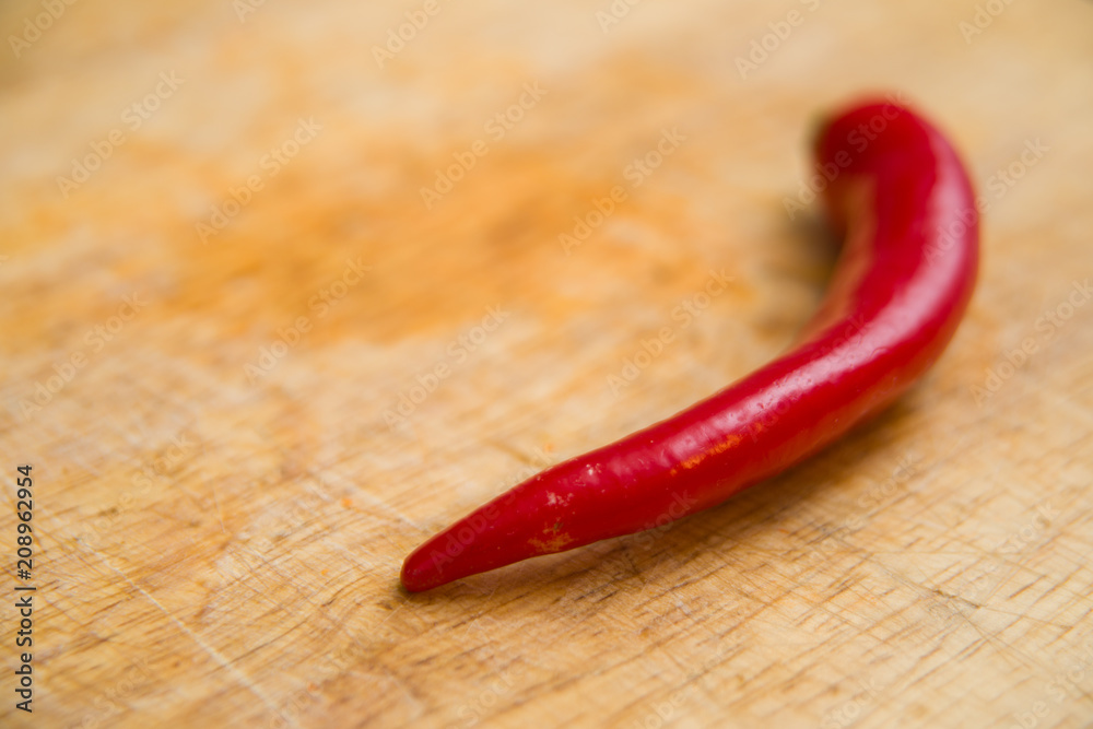 chili pepper on wood background chili pepper on wood background
