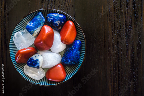 Φωτογραφία Bowl of Red, White and Blue Stones with Space for Copy
