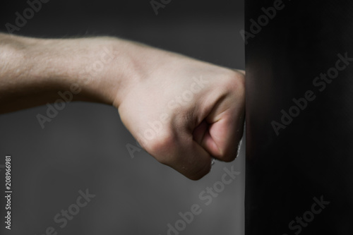 fist hits the punching bag photo