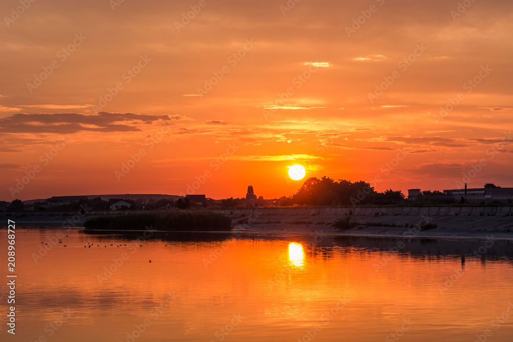 A Beautiful Orange Sunset by the Lake