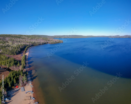 Aerial view of a big lake and the beach (Lac Normand), Reserve Saint-Maurice, Quebec Canada