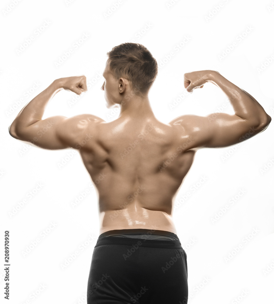 young bodybuilder shows muscles on his back