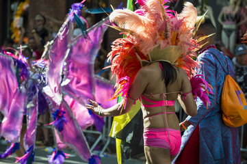 Participants dressed in flamboyant carnival costume participates in annual Pride Parade as it passes through Greenwich Village.