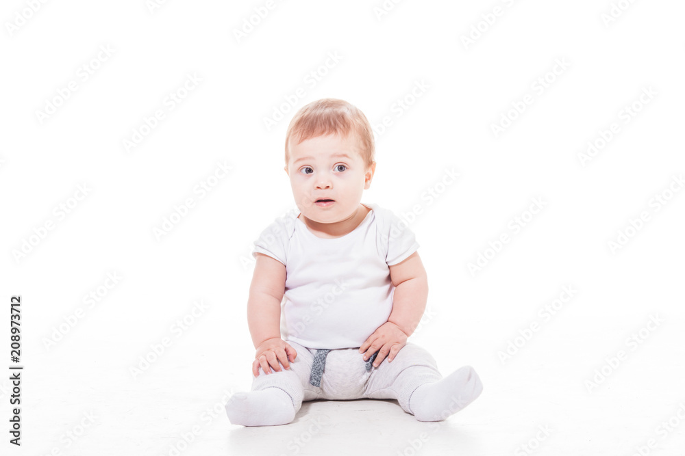 Happy baby is sitting on the floor Happy baby is sitting on the floor