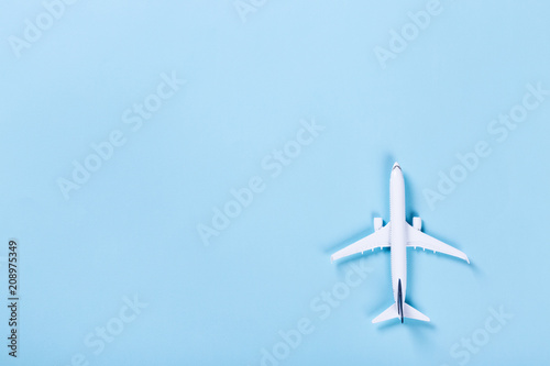 White blank model of passenger airplane on serenity colored paper texture