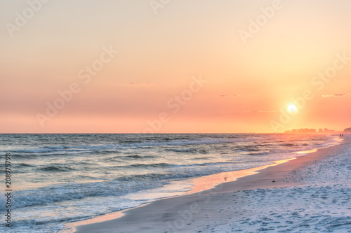 Fotografija Dreamy pink peach orange sunset in Santa Rosa Beach, Florida with Pensacola coas