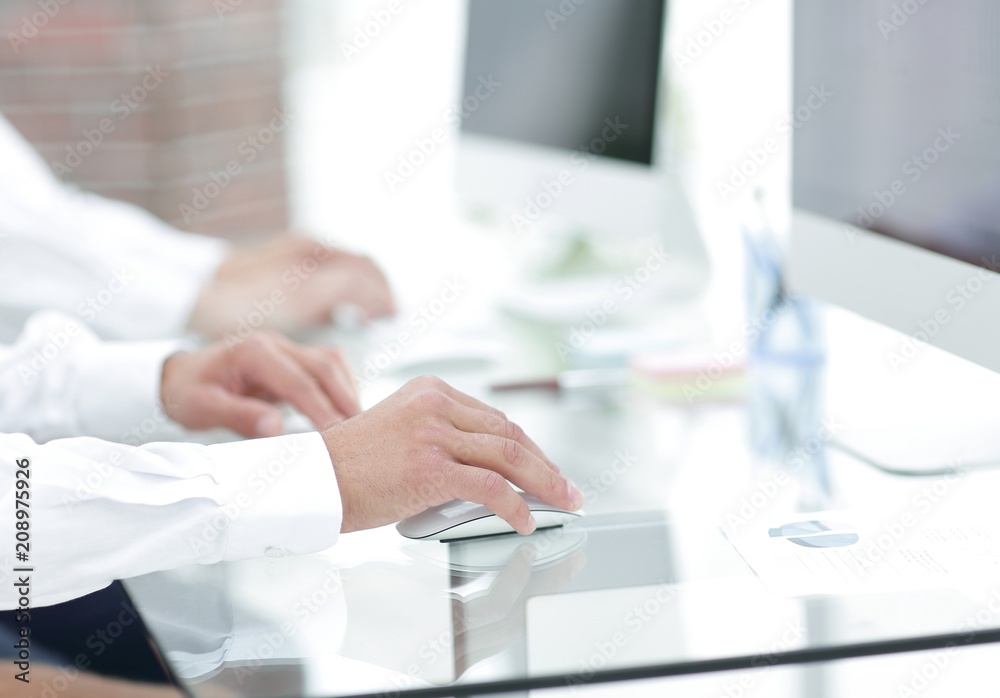 hands typing text on the computer keyboard. blurred business background. hands typing text on the computer keyboard. blurred business background.