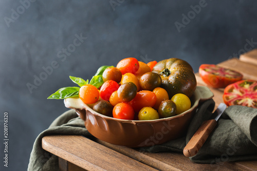 Fototapeta Naklejka Na Ścianę i Meble -  Assortment of ripe organic farmer cherry tomatoes on a table