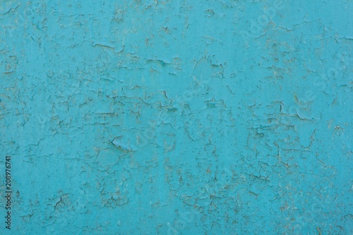 Texture background blue painted cracked iron surface.