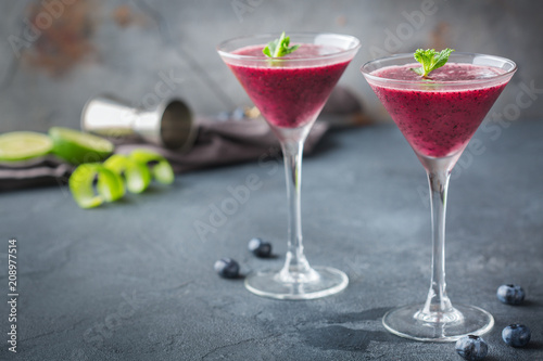 Alcohol frozen blueberry cocktail margarita with tequila and lime