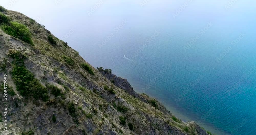 Impressive Rocks Over The Blue Sea. Aerial View Impressive Rocks Over The Blue Sea. Aerial View