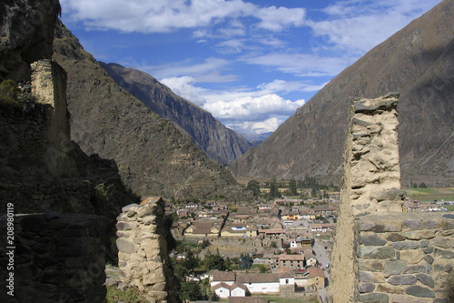 The town of Ollantaytambo  Peru  an Inca archaeological site  seen from the ruins of Machu Pichu  Peru