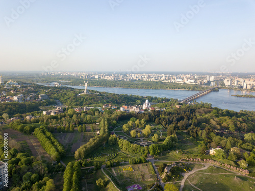 A bird's eye view, panoramic view from the drone to the Botanical Garden, Monument to the Motherland, Dnieper River, Paton Bridge in the city of Kiev, Ukraine