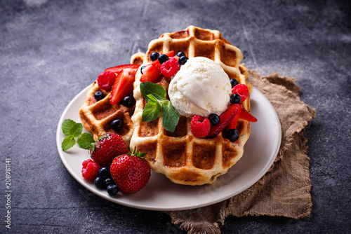 Belgium waffles with berries and ice cream