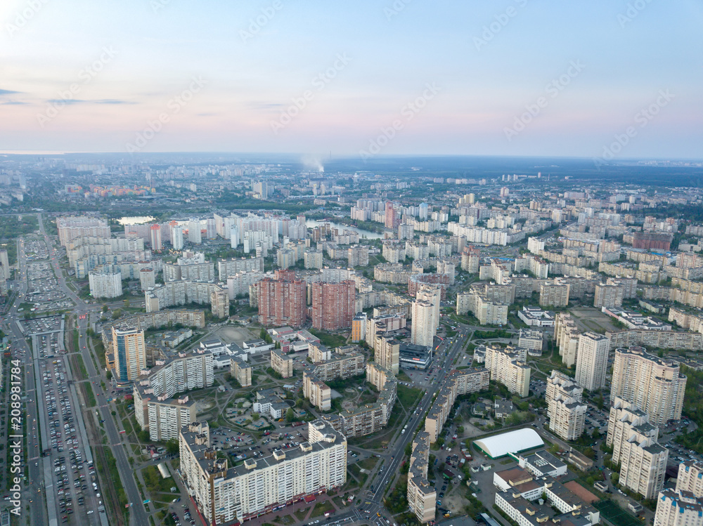 A bird's eye view, aerial panoramic view from drone to the Darnyts'kyi district of Kiev, Ukraine and the left bank of Dnieper.