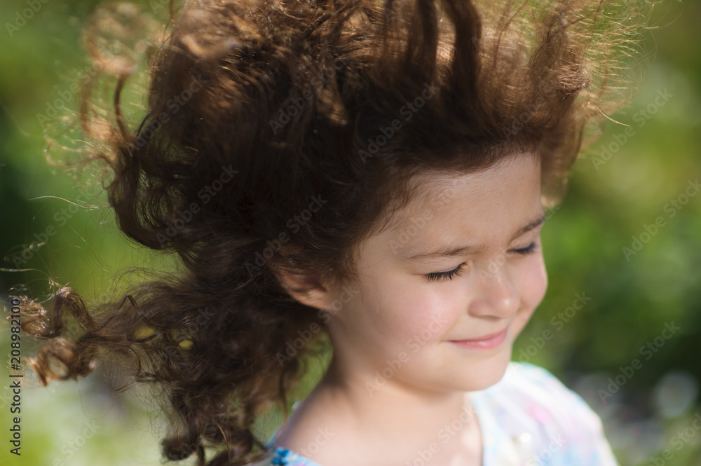 adorable little dreaming girl with gorgeous hair flutterring on wind in summer adorable little dreaming girl with gorgeous hair flutterring on wind in summer
