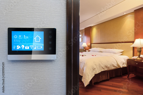 smart screen with smart home apps on wall in modern living room