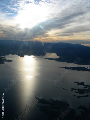 Sunlight on lake from helicopter
