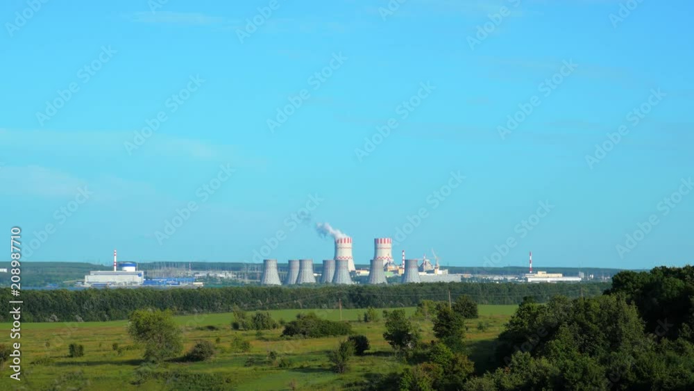 Nuclear power plant at green nature and sky background 4K Nuclear power plant at green nature and sky background 4K