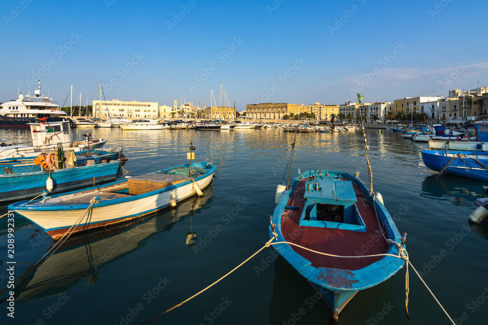Traditional fishing boats moored in Trani harbour, Apulia, Italy