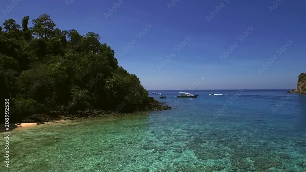 Aerial view of boats moored in the bay of Koh Rok Yai island. Aerial view of boats moored in the bay of Koh Rok Yai island.
