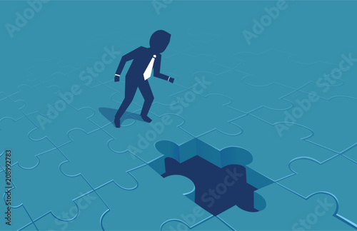 Vector of a businessman looking at a missing puzzle