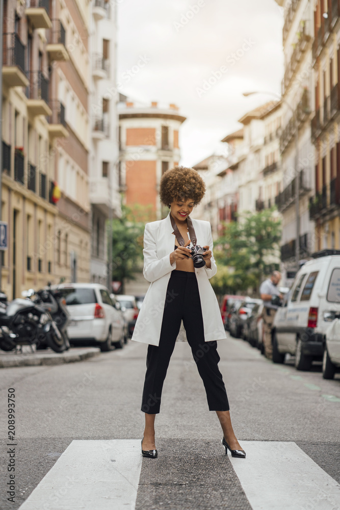 Female Photographer Holding an Old Analog Camera Female Photographer Holding an Old Analog Camera