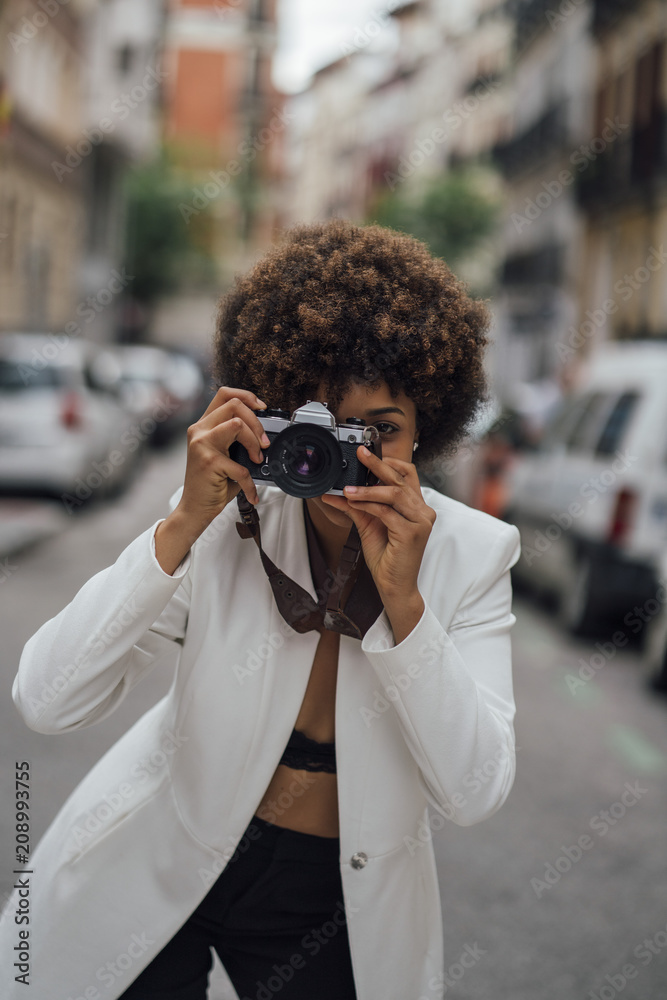 Female Photographer Holding an Old Analog Camera Female Photographer Holding an Old Analog Camera