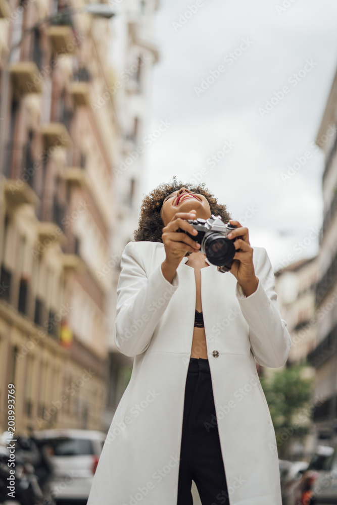 Female Photographer Holding an Old Analog Camera Female Photographer Holding an Old Analog Camera