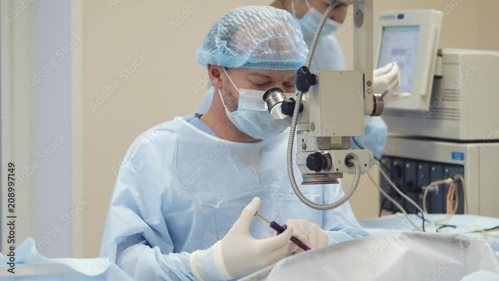 the doctor and his assistant are going to carry out the treatment ...