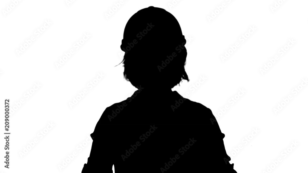 Silhouette Female engineer standing and talking to a camera track matte