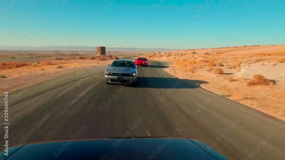 Race Cars on a Desert Track