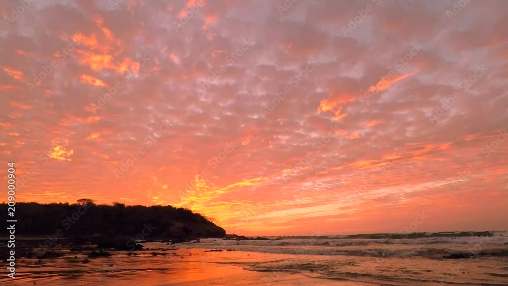 Waves crashing on the beach with a Beautiful Sunset in Mazatlan Mexico Waves crashing on the beach with a Beautiful Sunset in Mazatlan Mexico