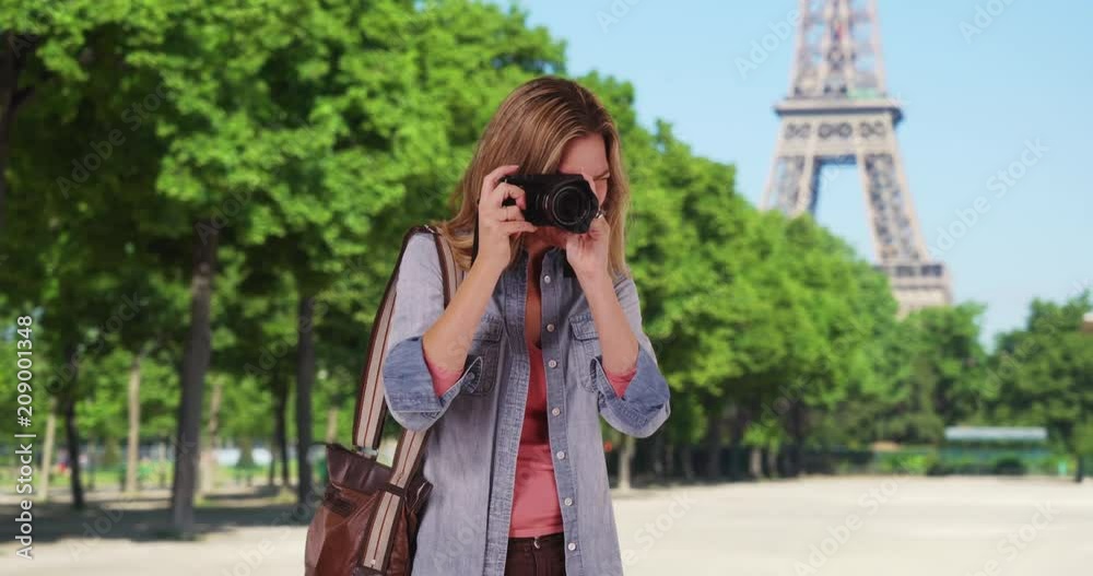 Travel photographer in Paris taking a picture outside smiling, Paris woman tourist taking photograph of summer vacation, 4k Travel photographer in Paris taking a picture outside smiling, Paris woman tourist taking photograph of summer vacation, 4k