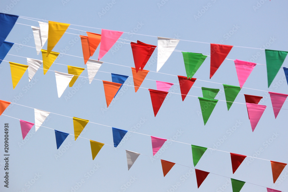colorful triangle flag with sky background colorful triangle flag with sky background