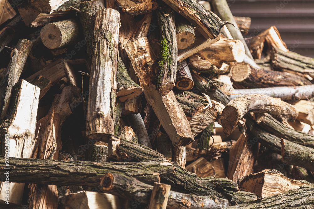 firewood of different shapes piled with bunch firewood of different shapes piled with bunch